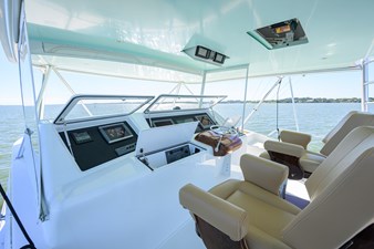 Flybridge Overhead boxes with Engine data, autopilot, and aft compartment with electric teaser reels