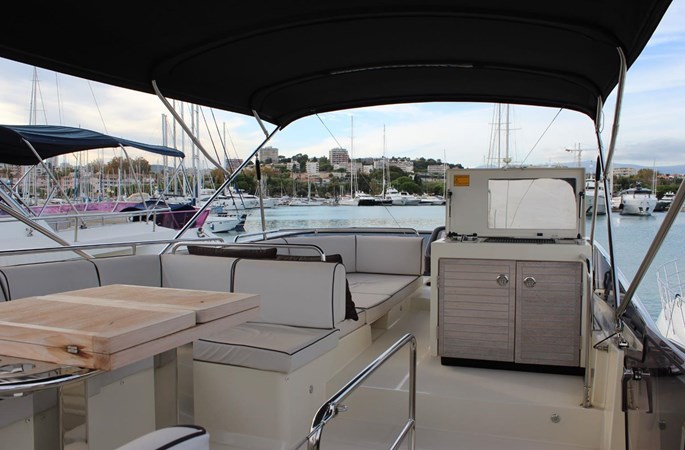 Exterior view of deck area on Monte Carlo 5, featuring her seating area