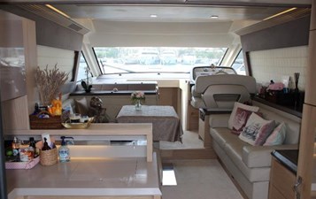 Interior view of salon on Monte Carlo, featuring comfortable seating area and a table