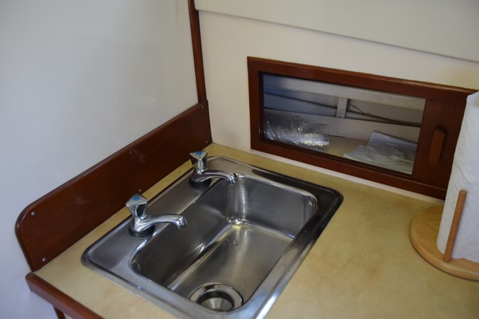 Stainless sink and storage behind