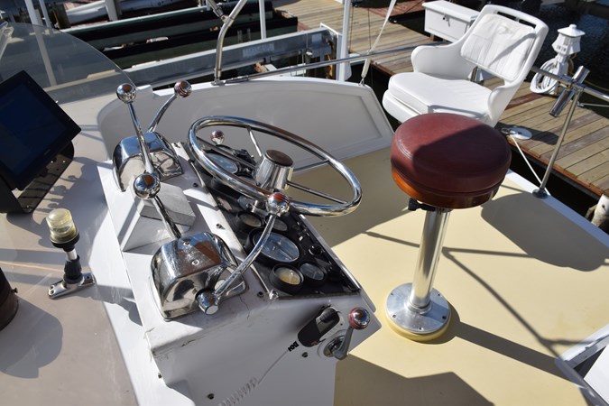 Companion chair on flybridge behind helm