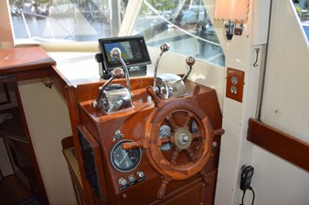 Teak cutter helm wheel at lower station