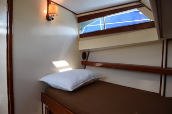 Portside of V-berth with window above