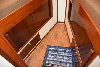Laminate wood sole. Cabinets and drawers below the V-berth