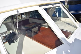 Forward deckhouse windows, center one can open from bottom