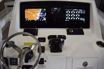 Dual Garmin 12-inch displays with Garmin autopilot between. Digital switching for boat systems via Garmin.