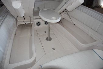 Larger storage compartments accessed with gas shock lifts beneath forward seating bases