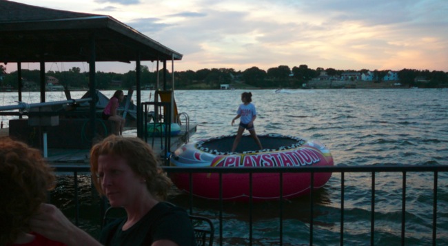 Innertube trampoline on lake