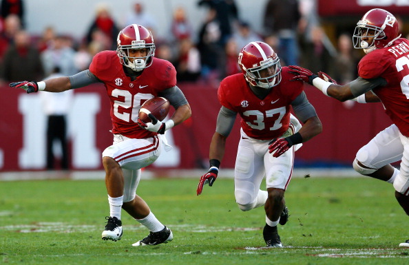 TUSCALOOSA, AL - NOVEMBER 24: Dee Milliner #28 of the Alabama Crimson Tide returns a fumble by Tre Mason #21 of the Auburn Tigers at Bryant-Denny Stadium on November 24, 2012 in Tuscaloosa, Alabama. (Photo by Kevin C. Cox/Getty Images)