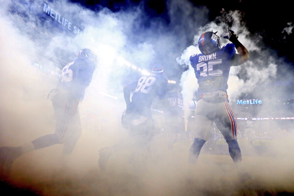 EAST RUTHERFORD, NJ - NOVEMBER 25: Running back Andre Brown #35 of the New York Giants points to the sky as he and his teammates take the field prior to playing against the Green Bay Packers at MetLife Stadium on November 25, 2012 in East Rutherford, New Jersey. (Photo by Al Bello/Getty Images)
