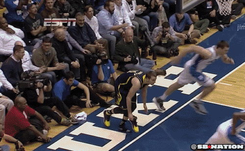 Michigan's Nik Stauskas Throws His Shoe at Duke's Cameron Crazies
