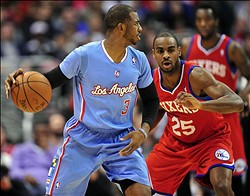 February 9, 2014; Los Angeles, CA, USA; Los Angeles Clippers point guard Chris Paul (3) moves the ball against the Philadelphia 76ers during the first half at Staples Center. Mandatory Credit: Gary A. Vasquez-USA TODAY Sports