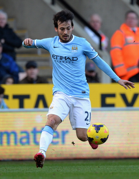 NORWICH, ENGLAND - FEBRUARY 08: David Silva of Manchester City during the Barclays Premier League match between Norwich City and Manchester City at Carrow Road on February 8, 2014 in Norwich, England. (Photo by Tony Marshall/Getty Images)