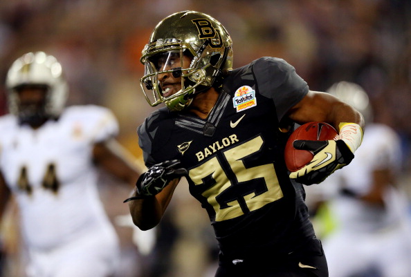 GLENDALE, AZ - JANUARY 01: Running back Lache Seastrunk #25 of the Baylor Bears carries the ball against the UCF Knights in the first quarter of the Tostitos Fiesta Bowl at University of Phoenix Stadium on January 1, 2014 in Glendale, Arizona. (Photo by Ronald Martinez/Getty Images)