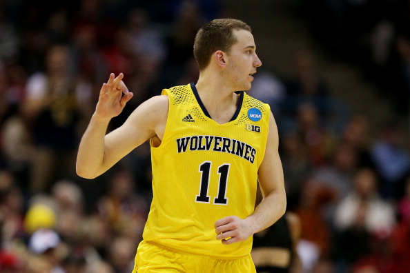 MILWAUKEE, WI - MARCH 20: Nik Stauskas #11 of the Michigan Wolverines celebrates a three point shot in the second half during the second round of the 2014 NCAA Men's Basketball Tournament at BMO Harris Bradley Center on March 20, 2014 in Milwaukee, Wisconsin. (Photo by Jonathan Daniel/Getty Images)