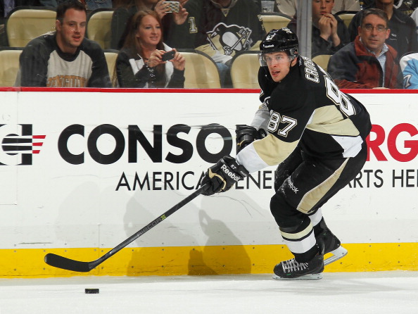 PITTSBURGH, PA - APRIL 9: Sidney Crosby #87 of the Pittsburgh Penguins moves the puck against the Detroit Red Wings on April 9, 2014 at Consol Energy Center in Pittsburgh, Pennsylvania. (Photo by Gregory Shamus/NHLI via Getty Images)