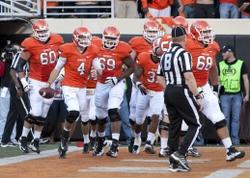 Nov 17, 2012; Stillwater OK, USA; Oklahoma State Cowboys cornerback Justin Gilbert (4) celebrates after a touchdown during the second quarter against the Texas Tech Red Raiders at Boone Pickens Stadium. Mandatory Credit: Richard Rowe-USA TODAY Sports