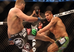 Sep 21, 2013; Toronto, Ontario, CAN; Matt Mitrione (left) kicks Brendan Schaub during their Heavyweight bout at UFC 165 at the Air Canada Centre. Mandatory Credit: Tom Szczerbowski-USA TODAY Sports