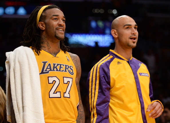 LOS ANGELES, CA - NOVEMBER 12: Jordan Hill #27 of the Los Angeles Lakers and Robert Sacre #50 react to the dunk of Xavier Henry #7 during a 116-95 win over the New Orleans Pelicans at Staples Center on November 12, 2013 in Los Angeles, California. NOTE TO USER: User expressly acknowledges and agrees that, by downloading and or using this Photograph, user is consenting to the terms and condition of the Getty Images License Agreement. (Photo by Harry How/Getty Images)