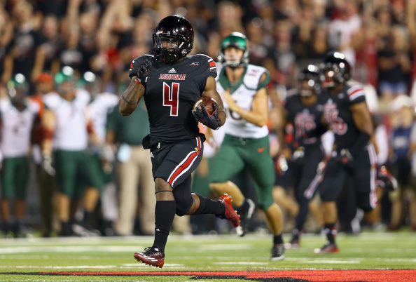 LOUISVILLE, KY - SEPTEMBER 01: Crovin Lamb #4 of the Louisville Cardinals runs for a touchdown on a kick off return during the game against the Miami Huricanesat Papa John's Cardinal Stadium on September 1, 2014 in Louisville, Kentucky. (Photo by Andy Lyons/Getty Images)