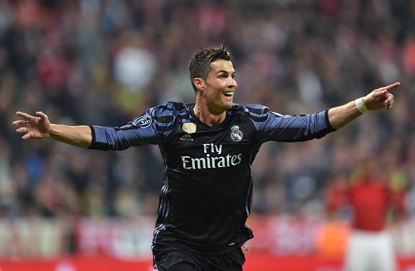 Real Madrid's Portuguese forward Cristiano Ronaldo celebrates after scoring during the UEFA Champions League 1st leg quarter-final football match FC Bayern Munich v Real Madrid in Munich, southen Germany on April 12, 2017.
Security was ratcheted up in Munich, one day after three explosions rocked the team bus of German football club Borussia Dortmund minutes after the bus set off to a planned Champions League game against Monaco on Tuesday night (April 11, 2017). / AFP PHOTO / Christof STACHE (Photo credit should read CHRISTOF STACHE/AFP/Getty Images)