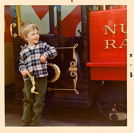 Sean (4) admiring letterforms on Nut Tree train