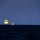 moon rising by Homer Butuyan
