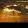 Spotlights Bathe the City by MICHAEL SWYGERT
