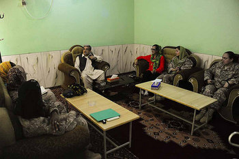 Farah Governor Rahool Amin discusses the need to develop a priority agenda for the women of Farah with the Female Engagement Team in Farah, Afghanistan, May 25. The FET is composed of a U.S. Agency for International Development representative and four female military service members assigned to PRT Farah.