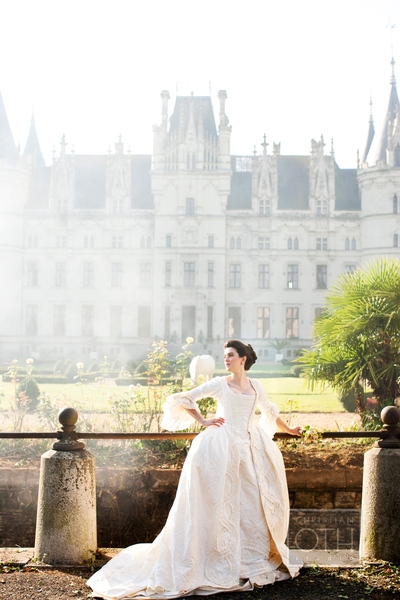 bride posing in front of chateau  - Shawn Connell of Christian Oth Studio