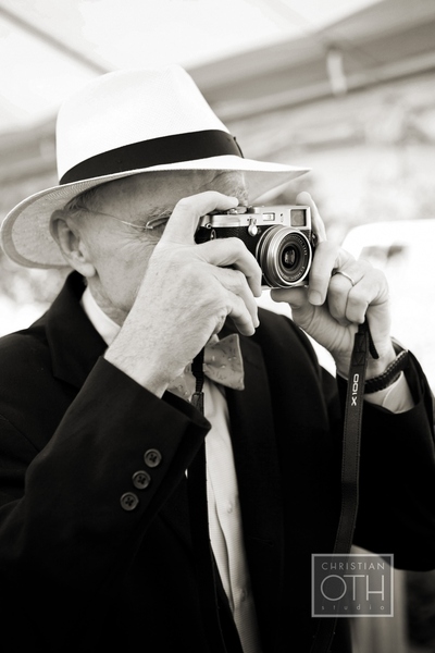 man with hat and camera - Christian Oth of Christian Oth Studio