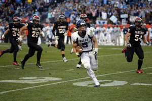 Valor running back Christian McCaffrey (5) outruns the Fairview defense for a long gain during the CHSAA 5A state championship game between Valor Christian and Fairview high schools, Saturday, Nov. 30, 2013, at Sports Authority Field at Mile High Stadium. (Kai Casey/CHSAANow.com)