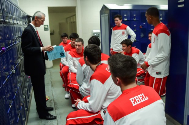 Regis Jesuit boys basketball coach Ken Shaw talks to his team before a game during the 2014 season. (Jack Eberhard/JacksActionShots.com)