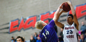 Dakota Ridge junior Devante Jones (23) has his shot blocked by Arvada West junior Will Wittman (14) during the opening quarter Wednesday night. Jones scored 10 points in the fourth quarter to help the Eagles put away a 62-48 victory. (Dennis Pleuss) 