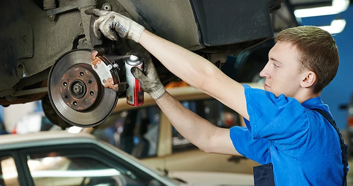 Service tech working on brakes