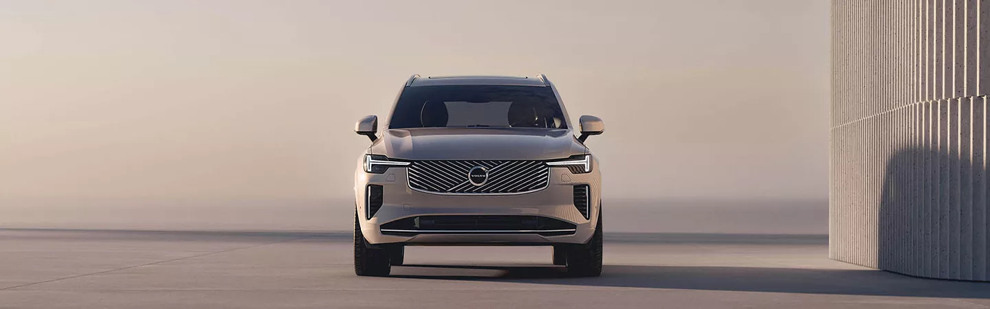 Front view of 2026 Volvo XC90 parked in a modern abstract setting