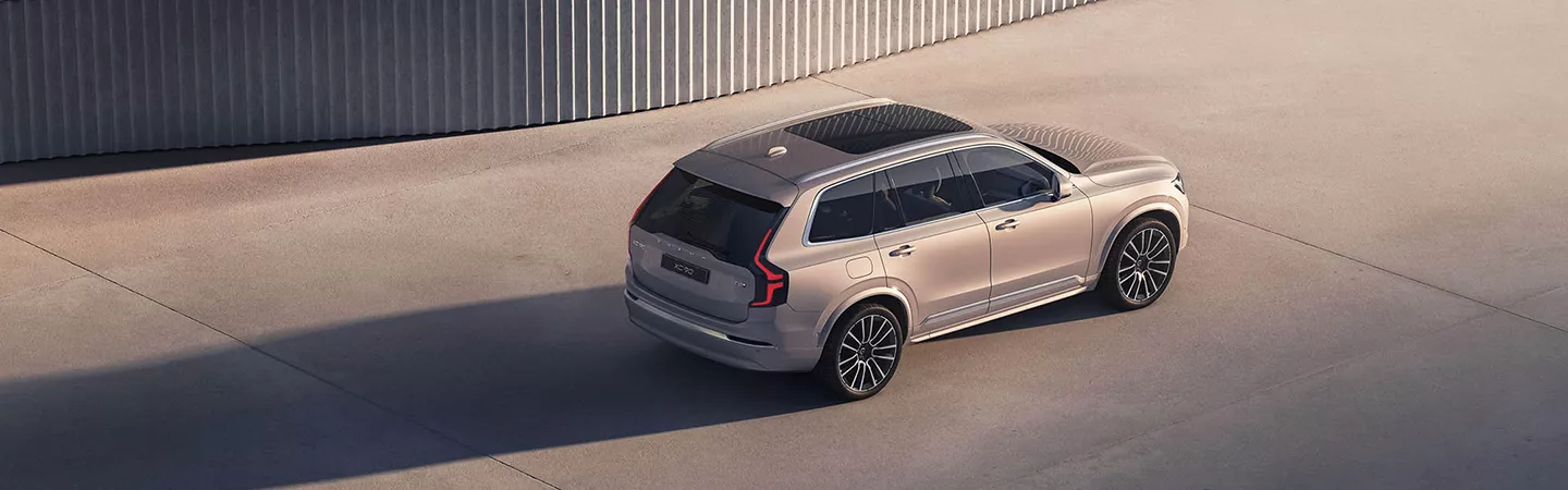 Aerial view of 2026 Volvo XC90 parked in a modern abstract setting