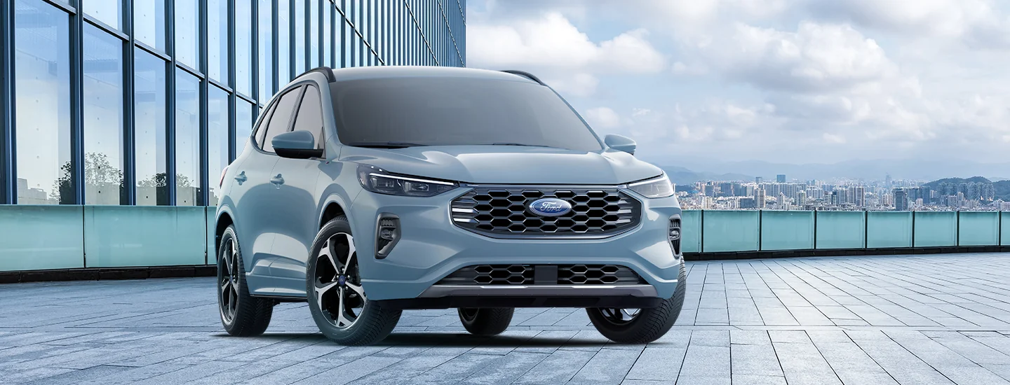 light blue 2025 Ford Escape parked on rooftop garage