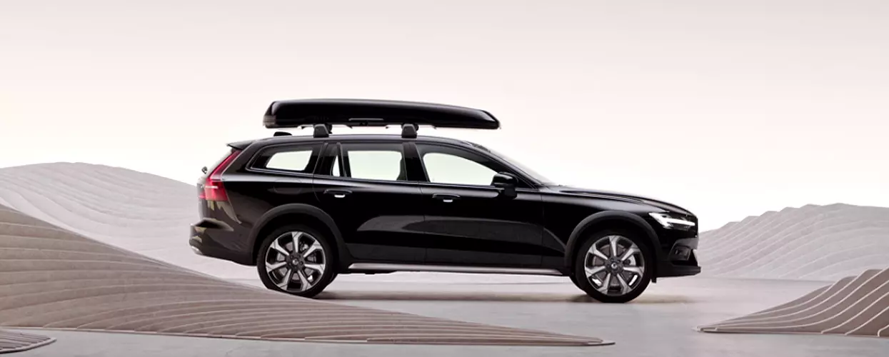 Side view of a parked black Volvo V60 Cross Country