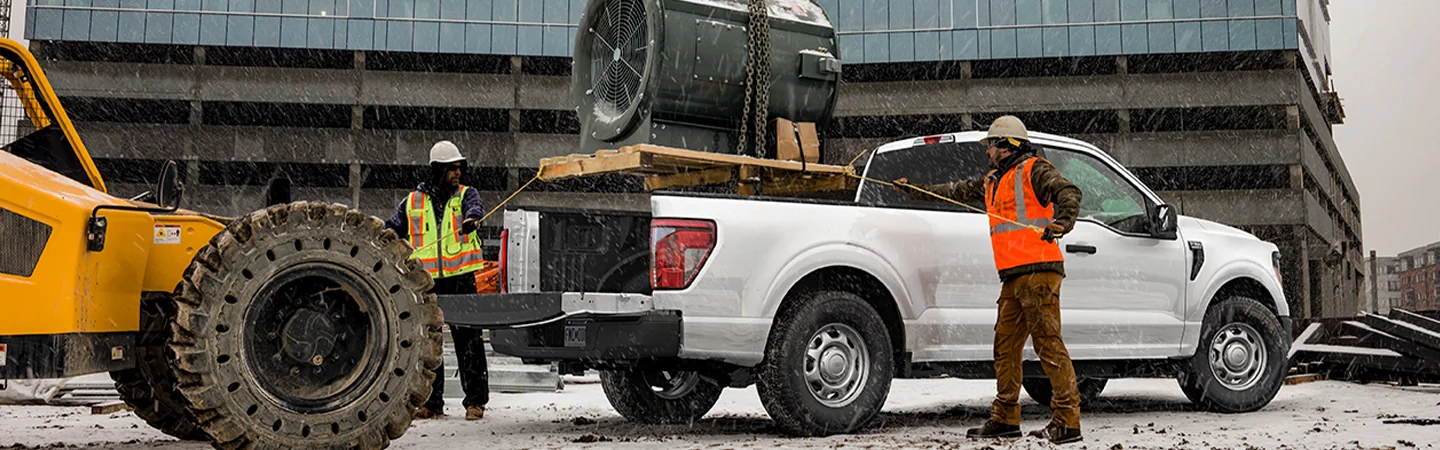 White 2025 Ford F-150 at a construction site