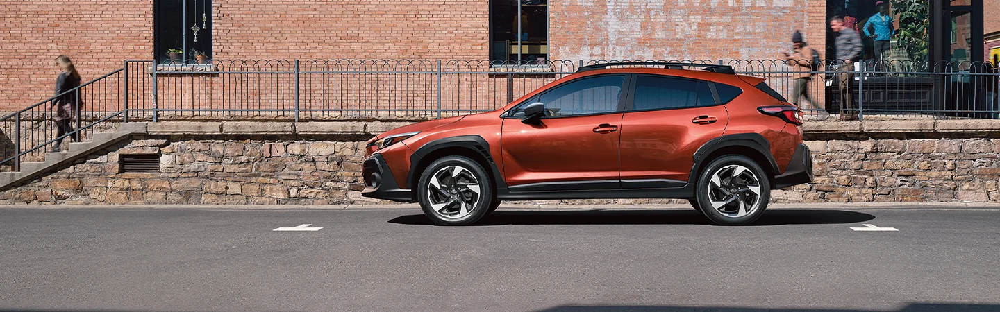 2025 Subaru Crosstrek vs Toyota Highlander Orange Color Side View