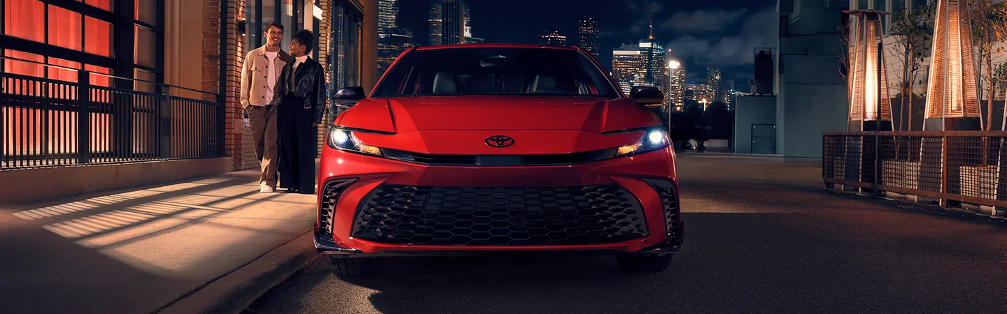 front view of a red 2026 Toyota Camry LE