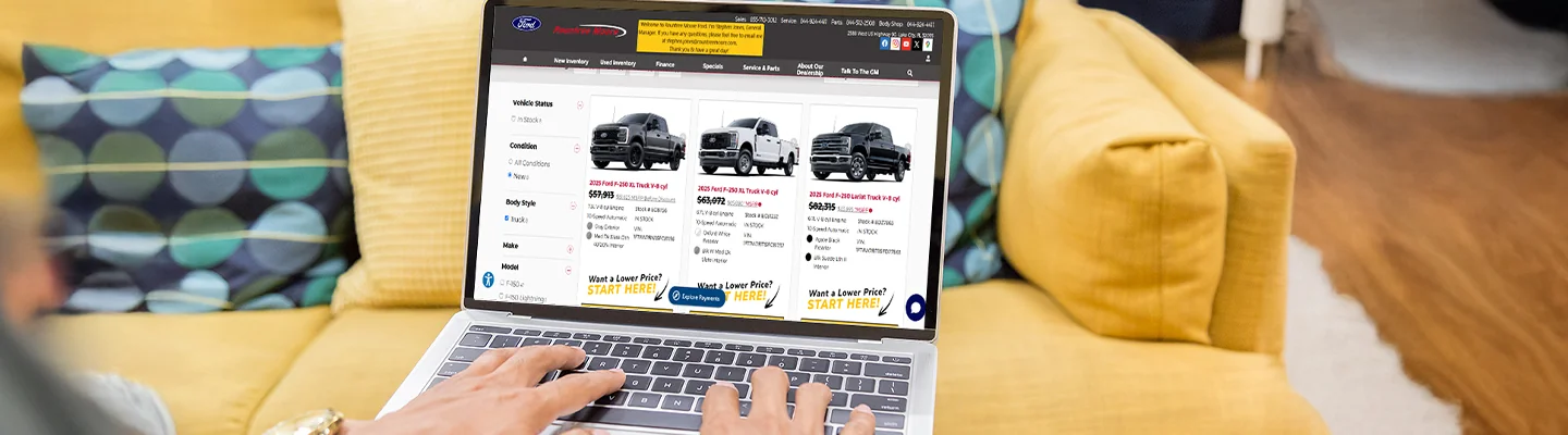 Shopping online on laptop at home with Rountree Moore Ford of Lake City, FL website on the screen