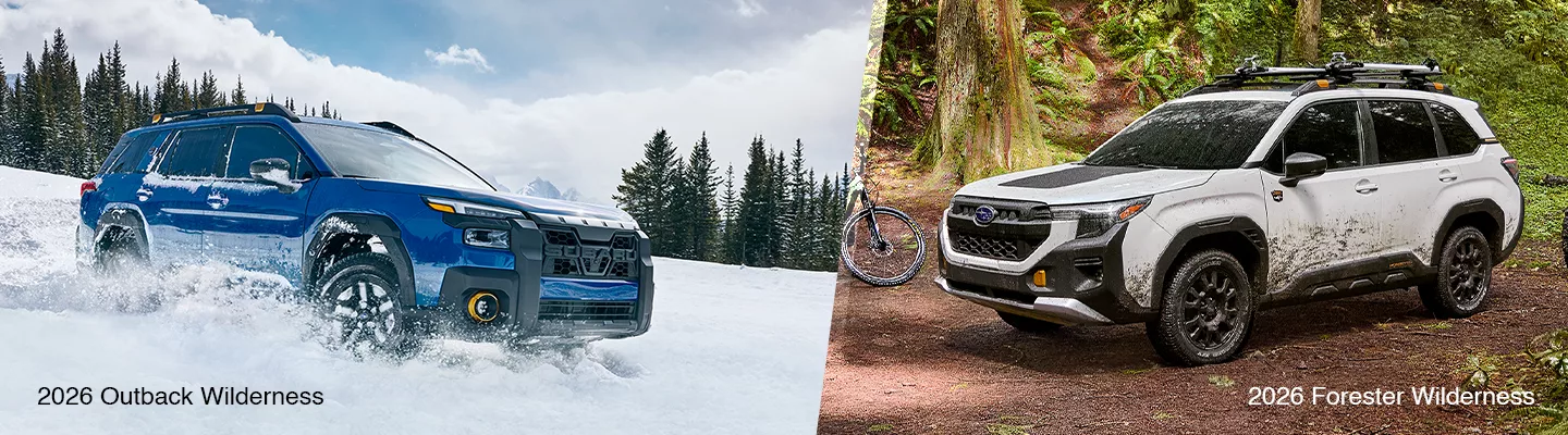 Side by side view of a new Subaru Forester and a new Subaru Outback with the Wilderness Package