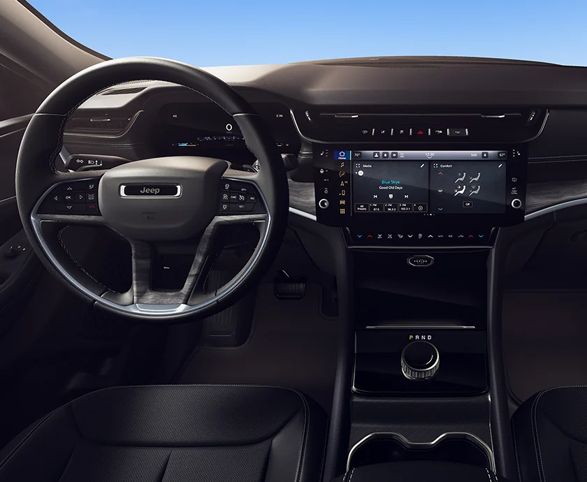 Interior view of the dashboard and tech of a 2026 Jeep Grand Cherokee