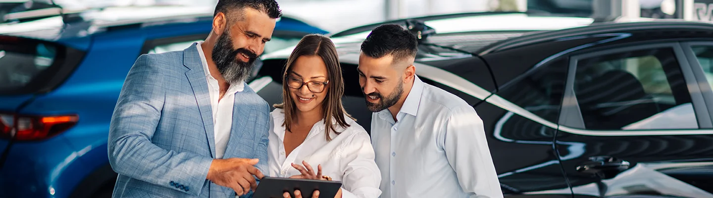 Customers speaking with a Ford salesperson