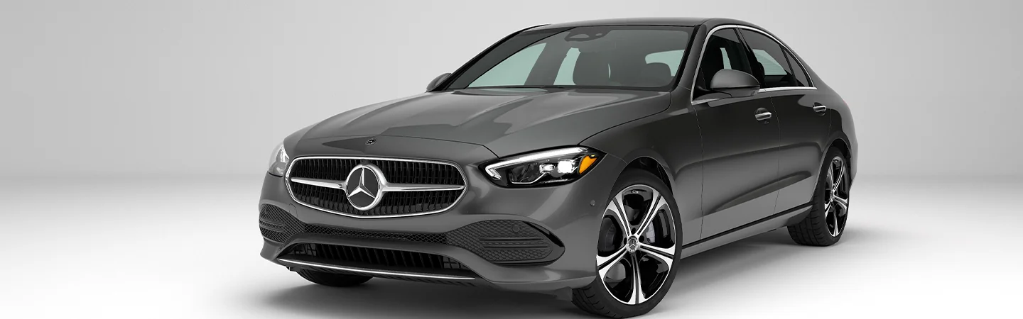 Front side view of a 2025 Mercedes-Benz C-Class parked in a show room