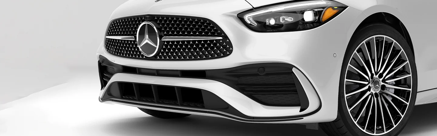 Close up view of the front end a white 2025 Mercedes-Benz C-Class