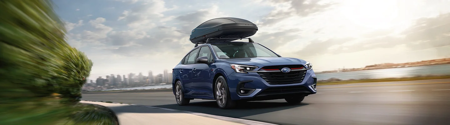 2025 Subaru Model with luggage carrier strapped on top