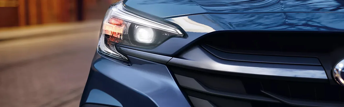 Blue 2025 Subaru Legacy front headlight view